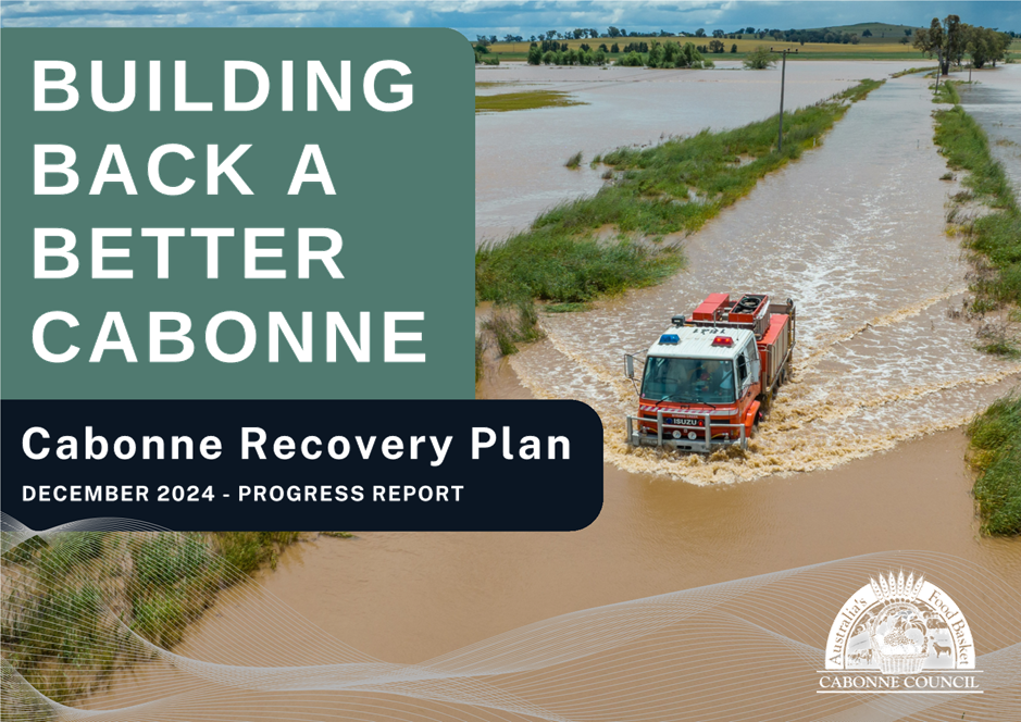 A truck driving through a flooded river

Description automatically generated